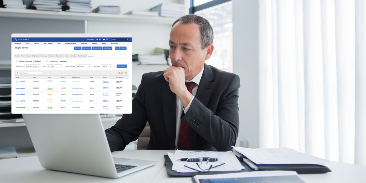 A lawyer looking at his laptop as he uses the Bill4Time site for timekeeping and billing