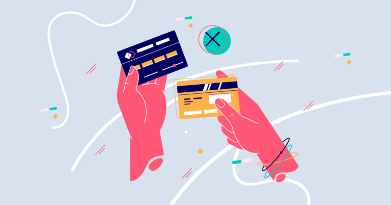 Hands looking at two credit cards