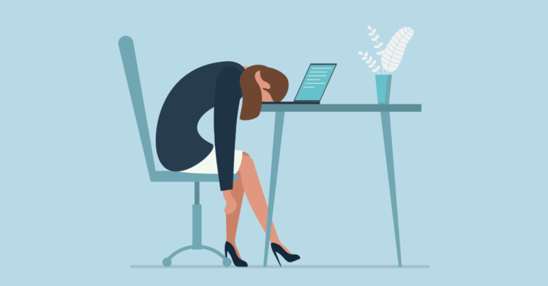 A tired lawyer slumped over at their desk